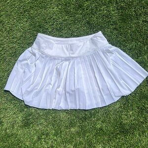 Athleta elevate white skirt. Size large with pleats. Built in shorts